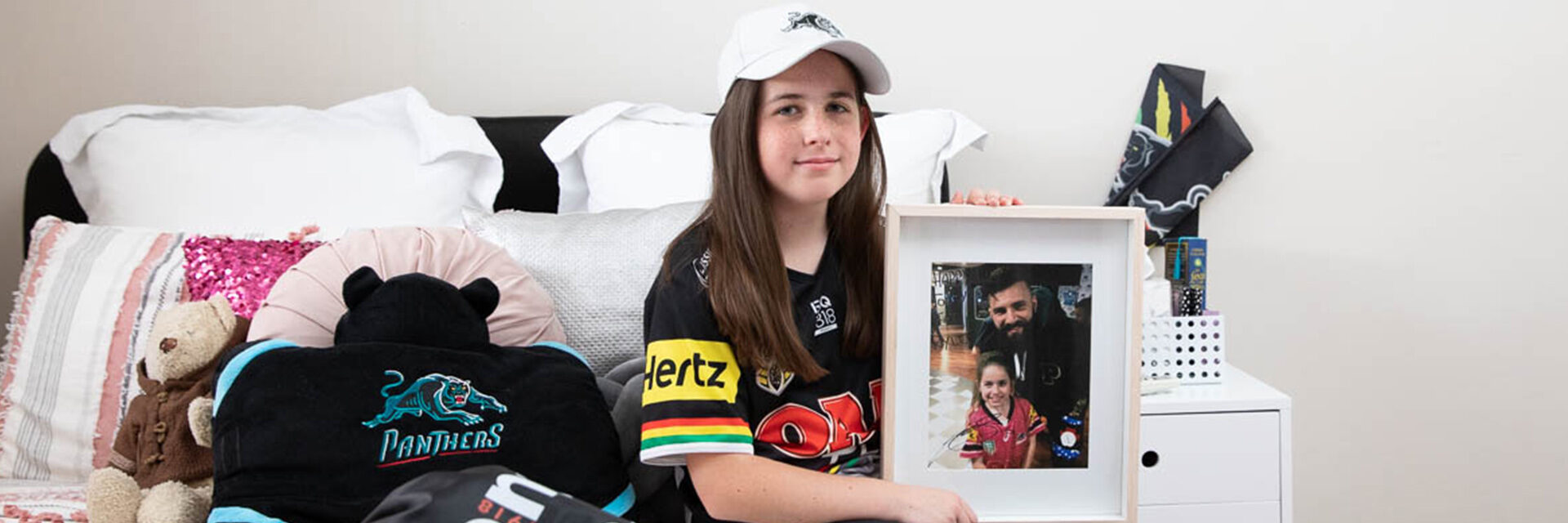 Eleven-year-old Rylee, Penrith, Holding a photo of the first time she met her absolute favourite player, Josh Mansour